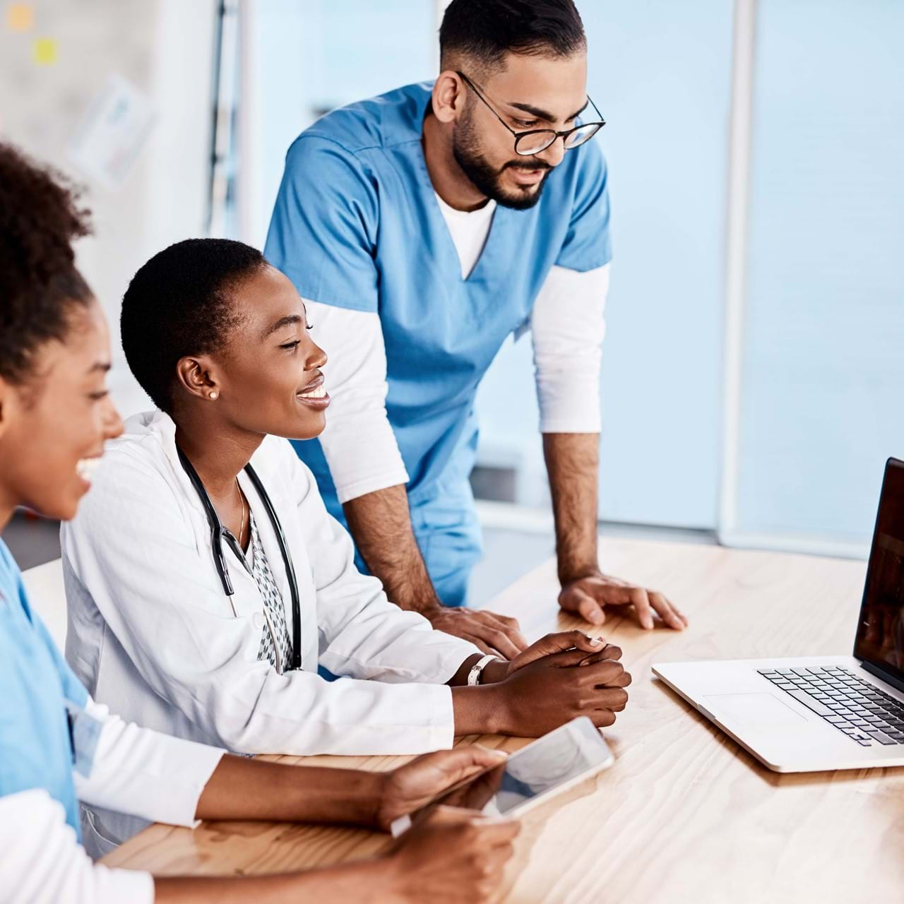 medical professionals using laptop