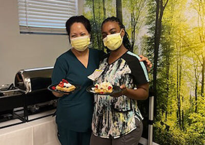 Among the nurses going for whipped cream and berries atop their waffles were Claudia Capili, RN, (left) and Desiree Kemp, RN.